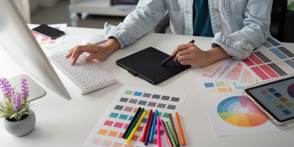 Asian woman graphic designer working in home office. Artist creative designer illustrator graphic